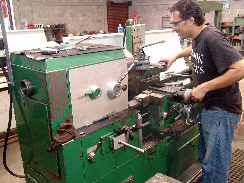 Man runs Lathe